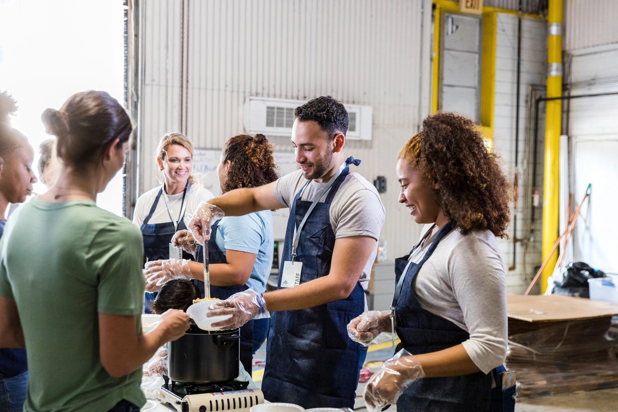 Volunteers serving food at a community outreach