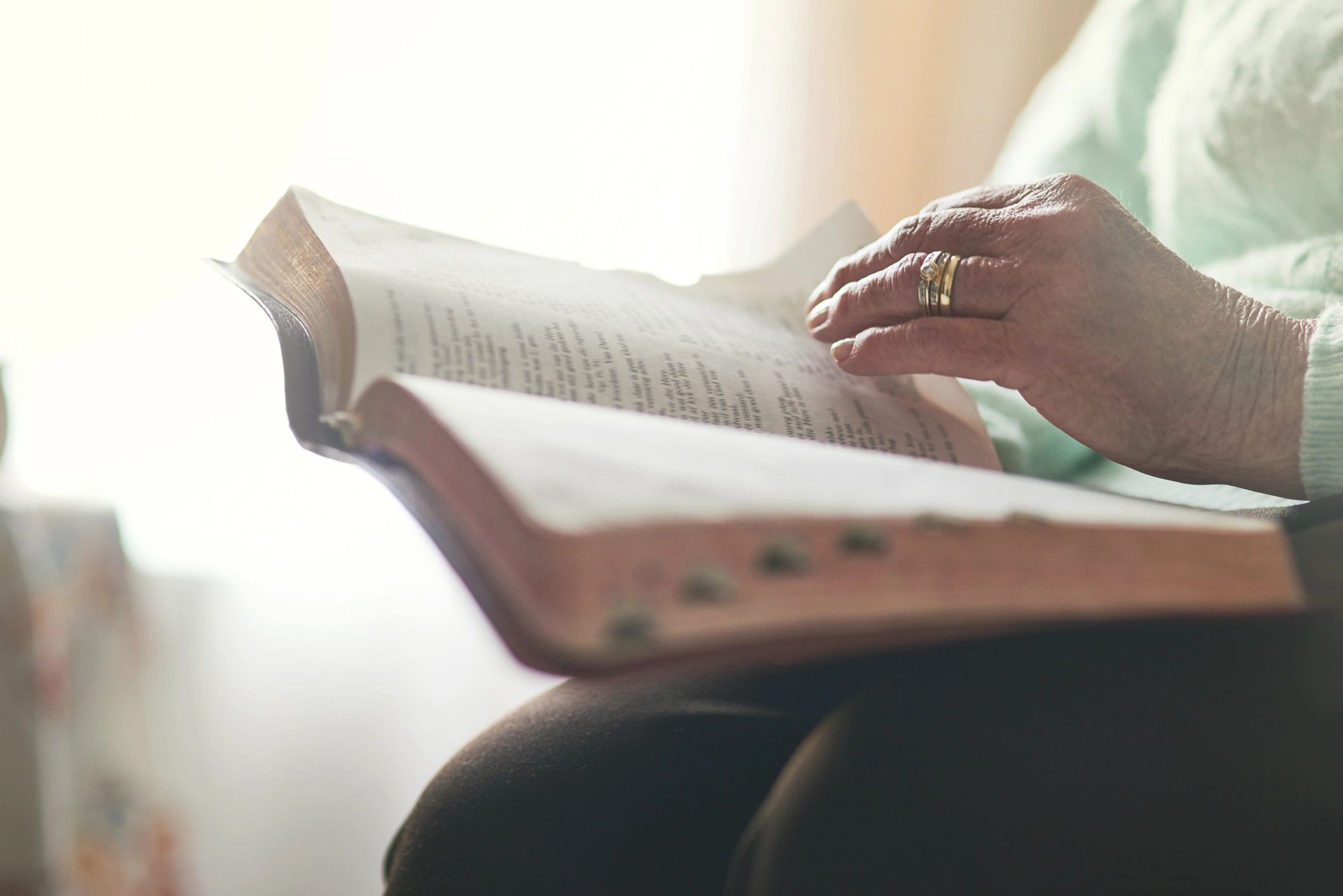 Person reading a Bible